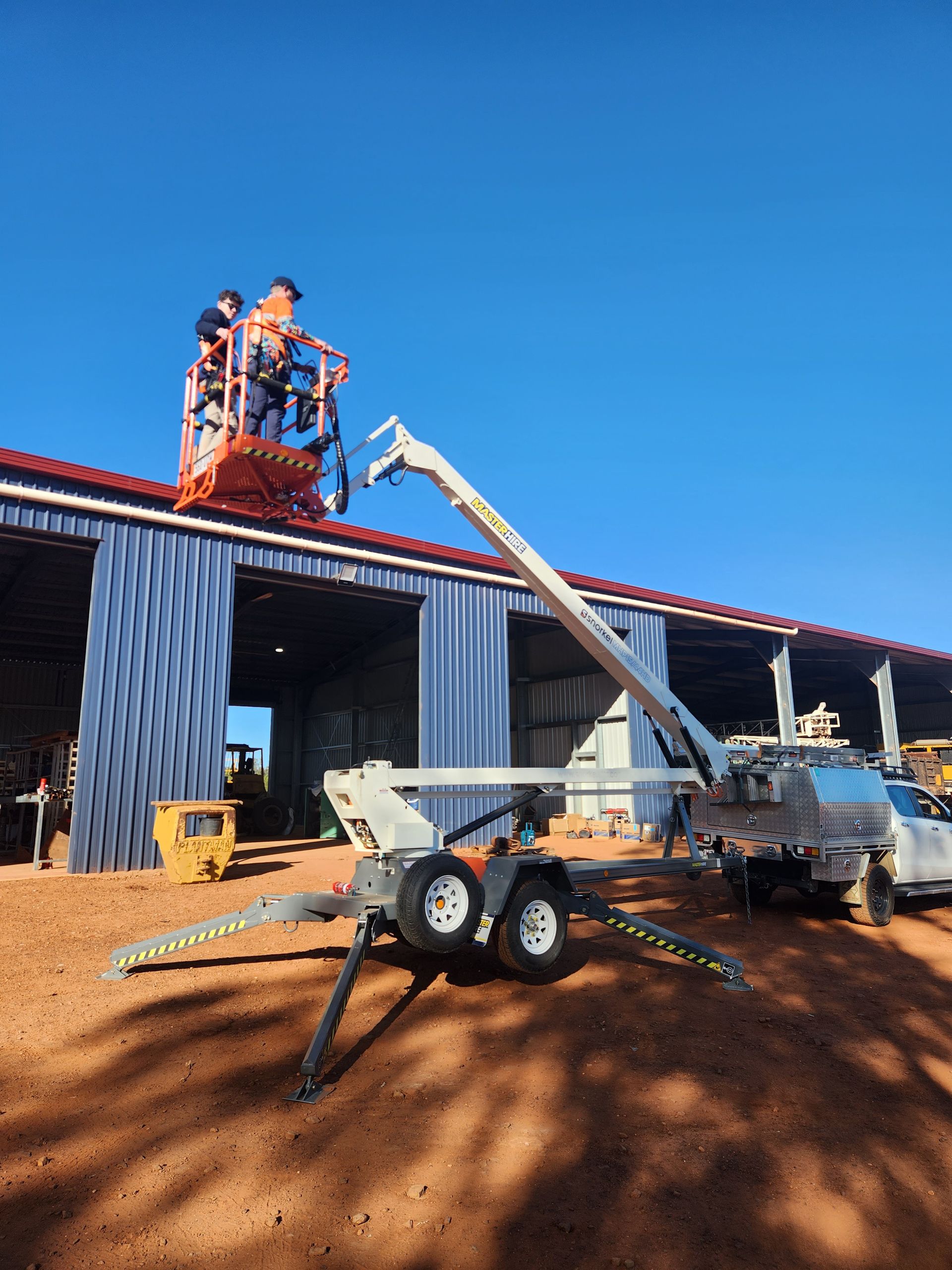 Frontier Security technicians working from an EWP lift on a Chinchilla site
